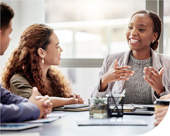 two office professionals discuss animatedly